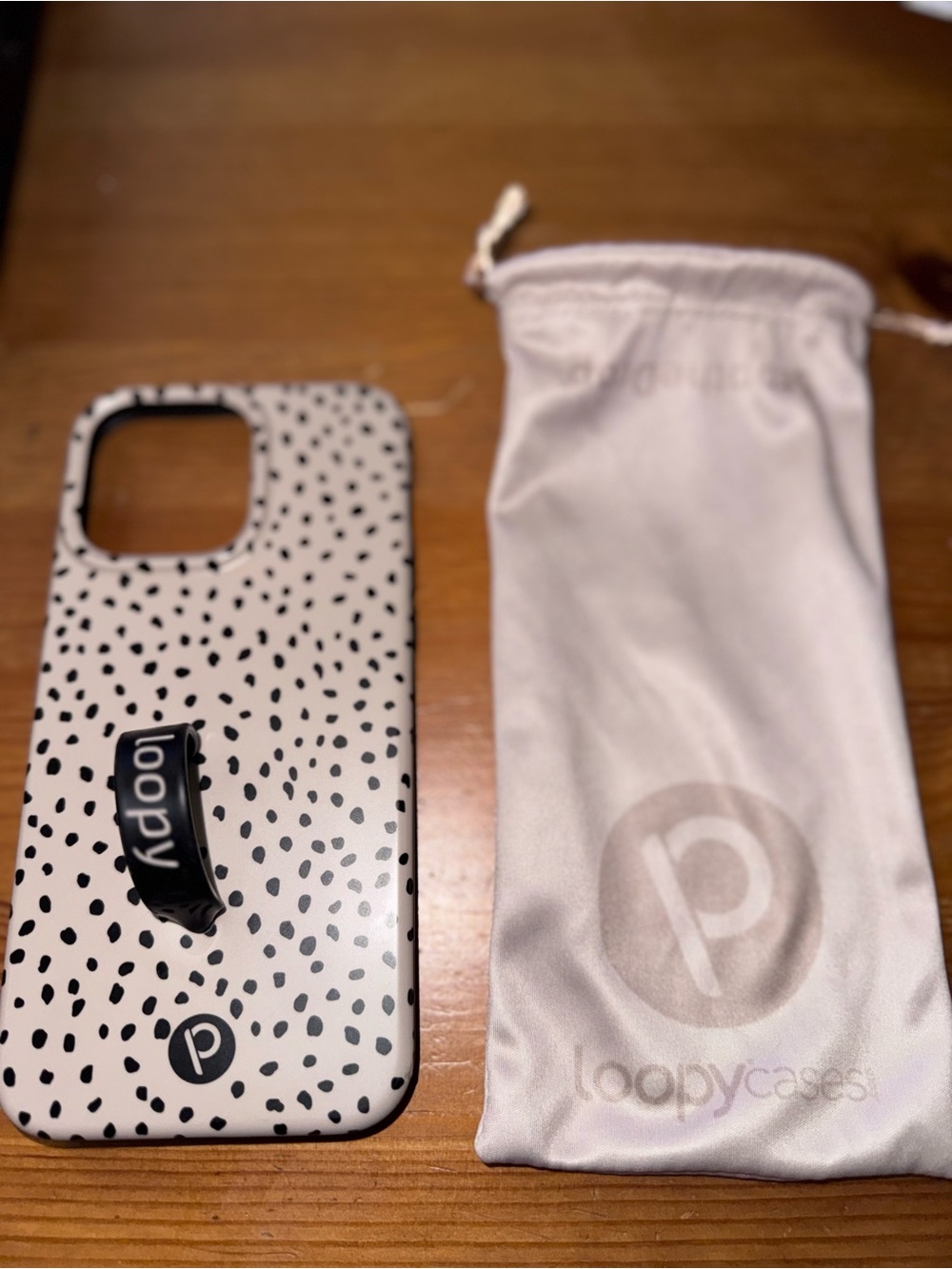 15 ProMax Loopy Case Cream Phone Case with Black Speckle Pattern and Black Loopy